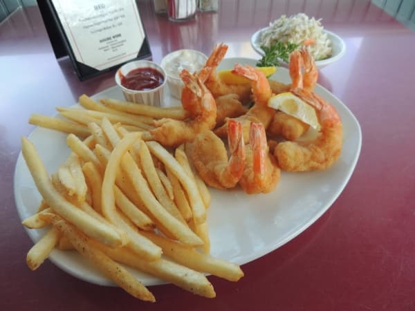 The Fried Shrimp Platter ($16.50), the most popular item, includes nine fried shrimp served with fries and coleslaw.