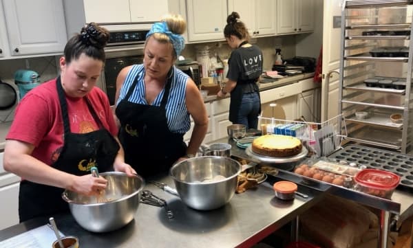 From left, baker Sumer Johnson, owner Shari Cahil and baker Jojo Hermann work in the kitchen at 18 Carrot Bakery. (Sally Grace Holtgrieve/Community Impact Newspaper)