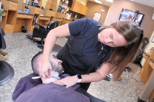 One of the barbershop's specialties is using a straight razor for trims and shaves. (Lindsey Juarez Monsivais/Community Impact Newspaper)