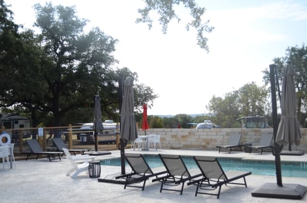 Guests are invited to enjoy a pool, cornhole, pickleball, volleyball, a playground and other amenities. 
(Amy Rae Dadamo/Community Impact Newspaper)