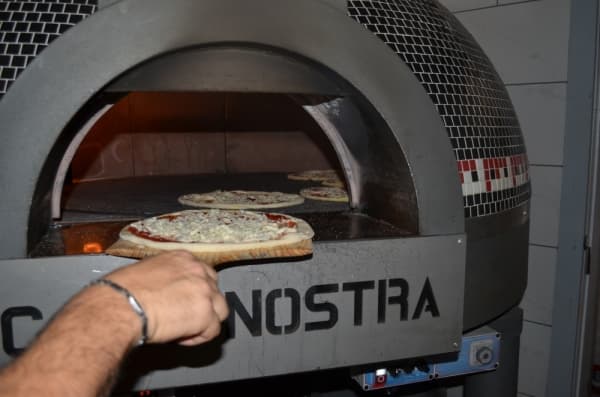 The Forza Forni Bistro is an Italian-made rotating wood pizza oven. Owner Jean Pelissero said Casa Nostra owns one of three in the state of Texas. 
