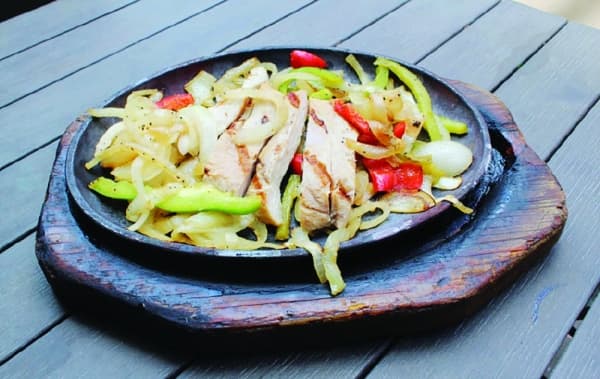 Arturo Vargas said one of his favorite dishes—and one of the restaurant's most popular—is the chicken fajita plate. (Anna Herod/Community Impact Newspaper)