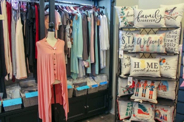 Lizzy G’s Fine Gifts carries a wide range of products, including boutique clothing and home decor items. (Hannah Zedaker/Community Impact Newspaper)  