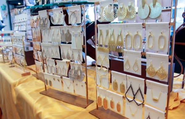 The store carries Kendra Scott earrings and necklaces. (Hannah Zedaker/Community Impact Newspaper)