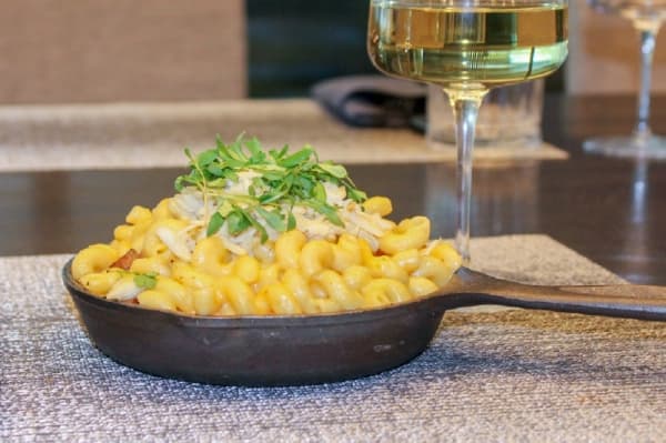 The Gulf Coast Mac N Cheese ($16) includes andouille sausage with locally sourced cheeses and butter-poached crab. (Adriana Rezal/Community Impact Newspaper) 
