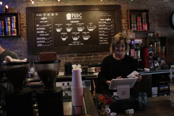 Coffeehouse Manager Kelly Cade has worked at The Perc since it opened in 2016. (Photo by Anna Herod/Community Impact Newspaper)