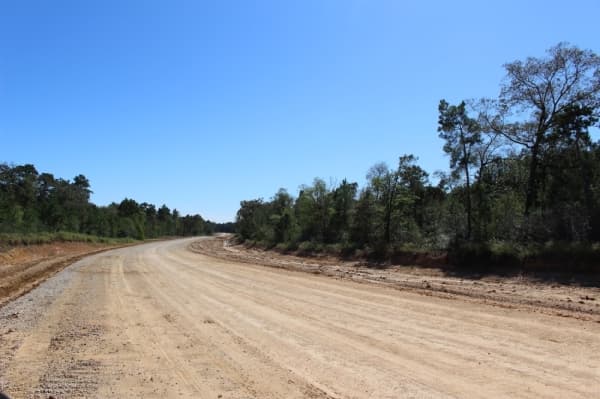 Grand Pines Drive will have one long S curve, Riley said, as opposed to the multiple sharp curves of the other routes out of the southwest portion of Magnolia. (Kara McIntyre/Community Impact Newspaper)