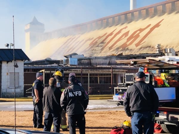 Crews from a Joint Incident Command response team battle a fire on the grounds of Wurstfest on Nov. 15. (Ian Pribanic/Community Impact Newspaper)