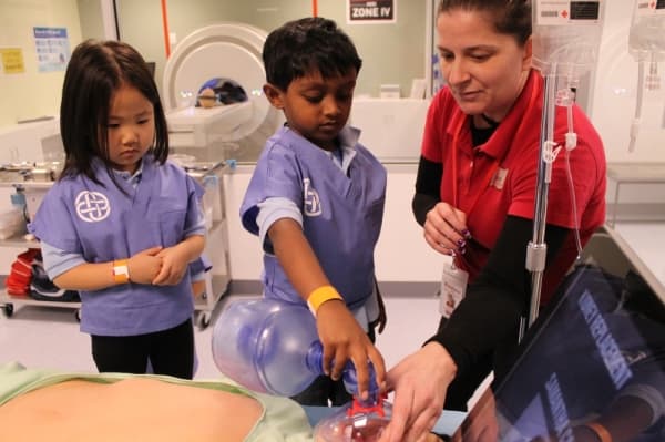 Children simulate a surgery at KidZania's hospital sponored by Texas Health Resources.