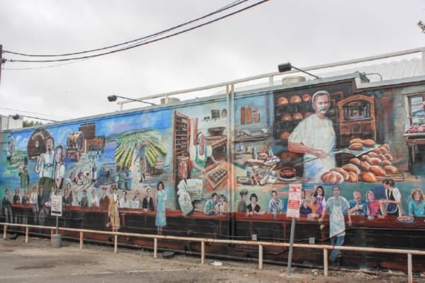 “Spass und Gemutlichkeit”
Location: 148 S. Castell Ave., New Braunfels 
Subject: The “Spass und Gemutlichkeit” mural celebrates Krause’s Café, where locals have gathered for more than 60 years. German traditions such as sausage, bread and brewing are portrayed alongside a traditional stammtisch table at which notable people from New Braunfels’ past are seated. 
Artist: Brent McCarthy 
Dedication date: April 19, 2007 
Price: $24,000 
