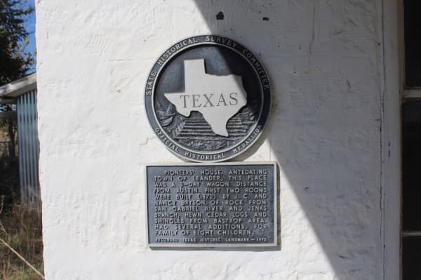 A historical marker shares background information on the Bryson Farmstead, which was built in 1872. (Marisa Charpentier/Community Impact Newspaper)