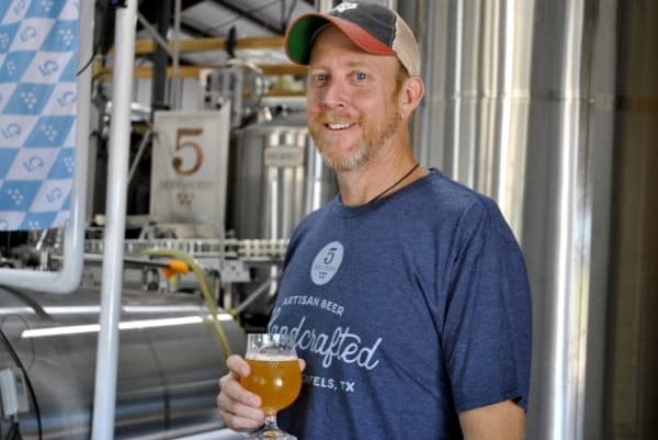 Though 5 Stones Artisan Brewery owner Seth Weatherly said it is risky to brew natural ingredients in “clean beer,” he said it makes a huge difference in the way that it tastes, which far outweighs the risks, in his opinion. (Chelsea Bagley/Community Impact Newspaper)