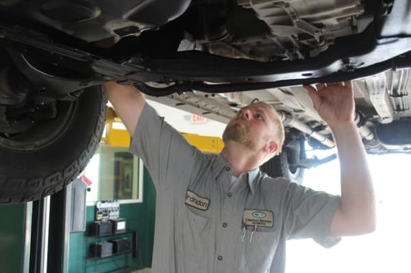 Automotive technician Brandon Akin checks under a customer’s car at Christian Brothers Automotive in Leander.
BRIAN PERDUE/COMMUNITY IMPACT NEWSPAPER