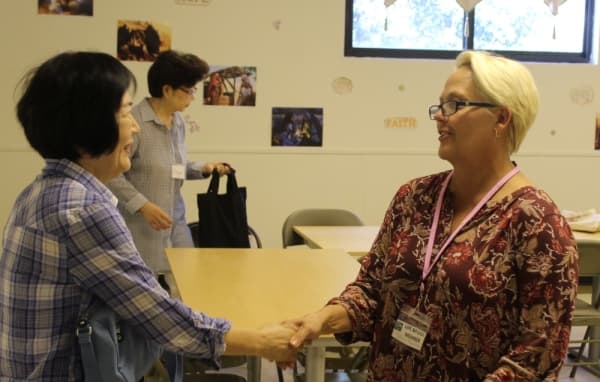 Gloria Pulatie (right) welcomes a new student to her beginner English class Sept. 24.
BRIAN PERDUE/COMMUNITY IMPACT NEWSPAPER