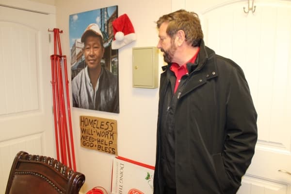 Stephen Thomas, director of The Salvation Army of Lewisville, said he keeps photos and signs around the facility to remind him of the organization's mission. (Photo by Anna Herod/Community Impact Newspaper)