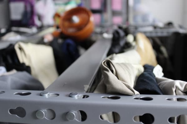 Volunteers help sort clothing once it is donated. (Photo by Anna Herod/Community Impact Newspaper)