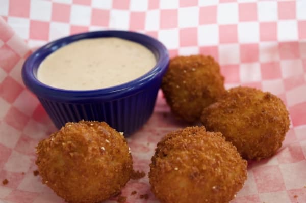 Blackland Truffles are deep-fried mashed potato balls stuffed with cheese, bacon bits and butter and served with a house-made chipotle ranch. (Taylor Jackson Buchanan/Community Impact Newspaper)