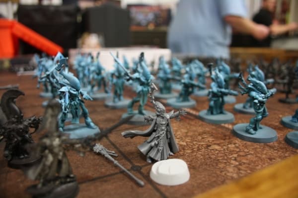 An unpainted figure from the tabletop game Warhammer 40K is on display at Atomic Hobby Shop.