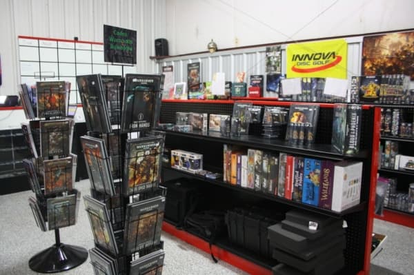 Merchandise at Atomic Hobby Shop includes board games, figurines and gaming accessories.