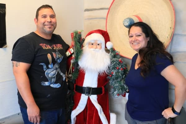 Estevan and Nancy Salinas, owners of Alamo Tamales To Go, enjoy serving and putting smiles on locals’ faces. (Alex Grant/Community Impact Newspaper)