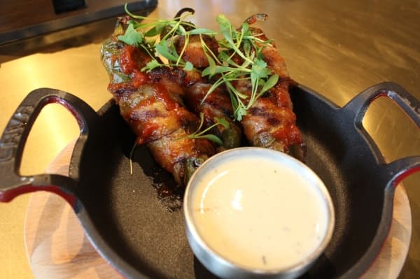 Trophy Poppers are one of the restaurant's most popular appetizers, or "warmups." (Elizabeth Ucles/Community Impact Newspaper)