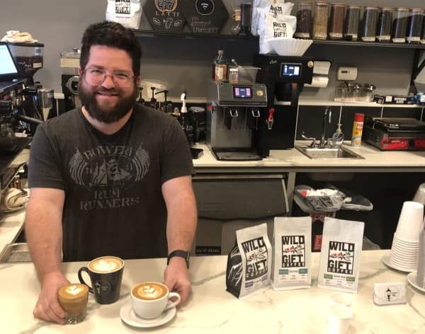 Lamppost Coffee owner Brian Burns serves, from left: a cortado, Lamba Latte and cappuccino. (Sally Grace Holtgrieve/Community Impact Newspaper)