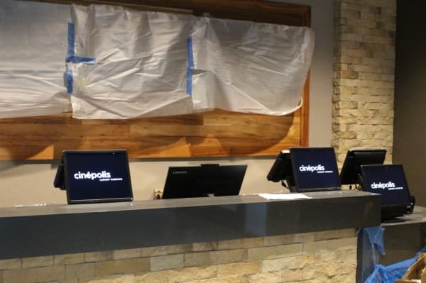 The front entrance of Cinepolis is kept minimal, with no concession stand. Photo by Andrew Christman/Community Impact Newspaper