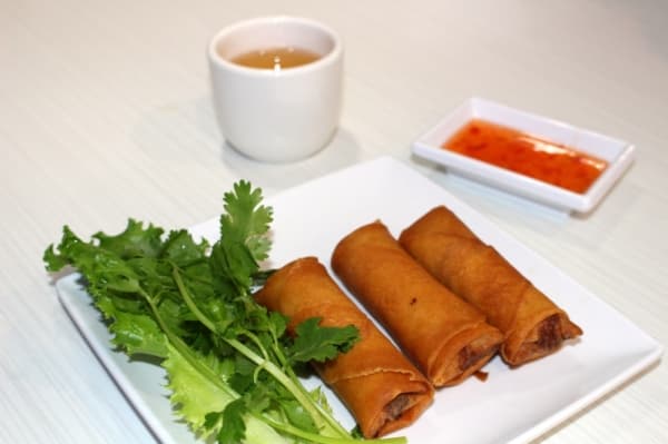 Appetizers at TT Pho include traditional egg rolls ($2.99) served with fish sauce and pictured with a cup of the restaurant's hot tea ($5/pot). Ben Thompson/Community Impact Newspaper