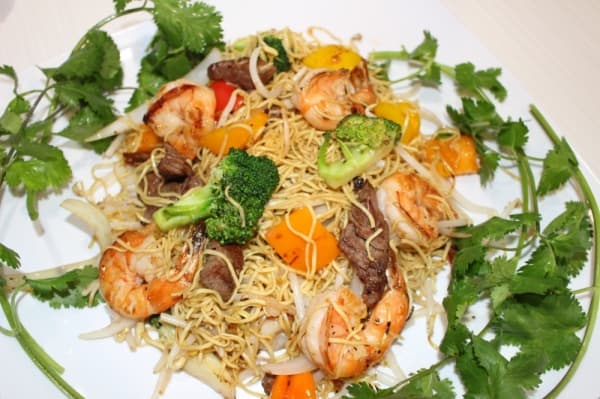 The combination stir-fry plate ($12.99) comes with vegetables, beef and shrimp in a serving of egg noodles. Ben Thompson/Community Impact Newspaper