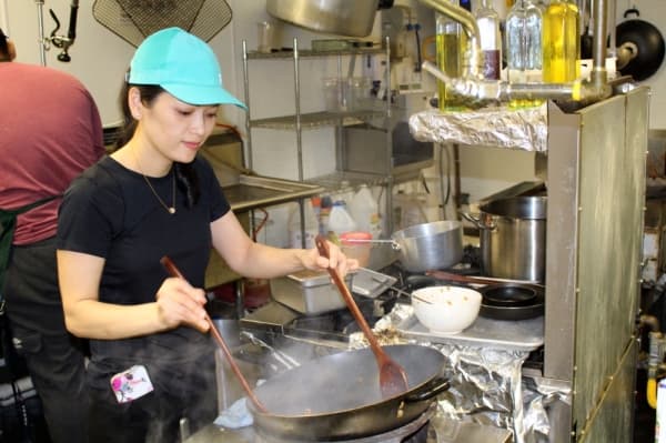 Owner Thao Vo said she spends much of her time at TT Pho assisting with food preparation in the restaurant's kitchen. Ben Thompson/Community Impact Newspaper