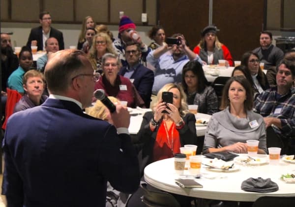 Cedar Park Mayor Corbin Van Arsdale (left) speaks to the crowd attending the State of the City speech Dec. 12. (Brian Perdue, Community Impact Newspaper)