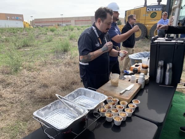 Caesar Ortiz, a consulting chef for Spare Birdie, made pretzel crostini and pimento cheese for attendees to enjoy. (Marisa Charpentier/Community Impact Newspaper)