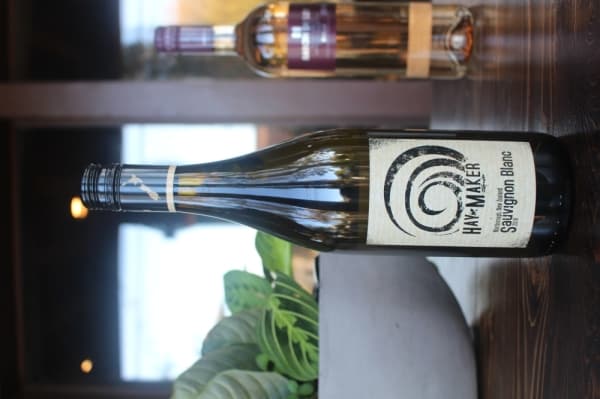 The Haymaker is a sauvignon blanc wine that can be paired with spinach and artichoke dip, owner Jean Paul said. (Evelin Garcia/Community Impact Newspaper)
