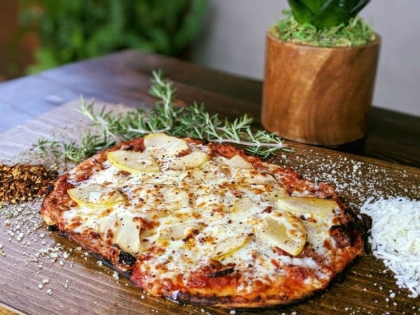 The pear and bacon pizza on naan bread is a rotating special at Patio Dolcetto. 