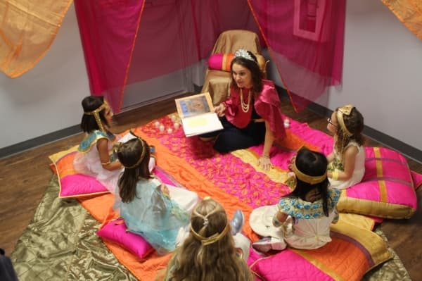 Sterling Classical School students listen to a story during the Egyptian feast. (Brian Perdue, Community Impact Newspaper)