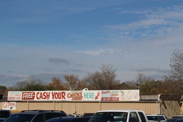 Newly released offenders are greeted with these signs once they leave Huntsville Unit. (Eva Vigh/Community Impact Newspaper)