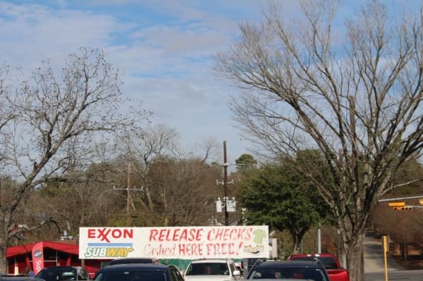 Newly released offenders are greeted with these signs once they leave Huntsville Unit. (Eva Vigh/Community Impact Newspaper)