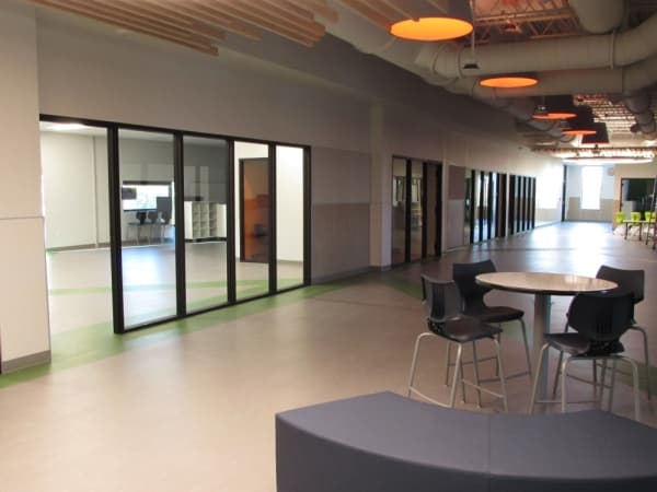 Menchaca Elementary is designed to create "learning neighborhoods," where individual classrooms share a centralized space with tables, seating and other resources for students. (Nicholas Cicale/Community Impact Newspaper)