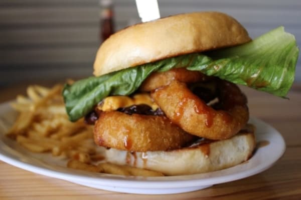 Old Magnolia Bar & Grill's menu featured specialty burgers and other dishes, including breakfast options. (Kara McIntyre/Community Impact Newspaper)