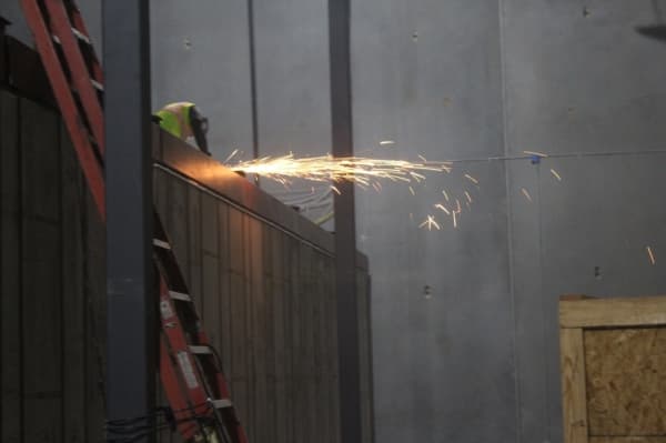 A construction worker works on the inside of the depository, which is anticipated to be complete in early 2020. (Marisa Charpentier/Community Impact Newspaper)