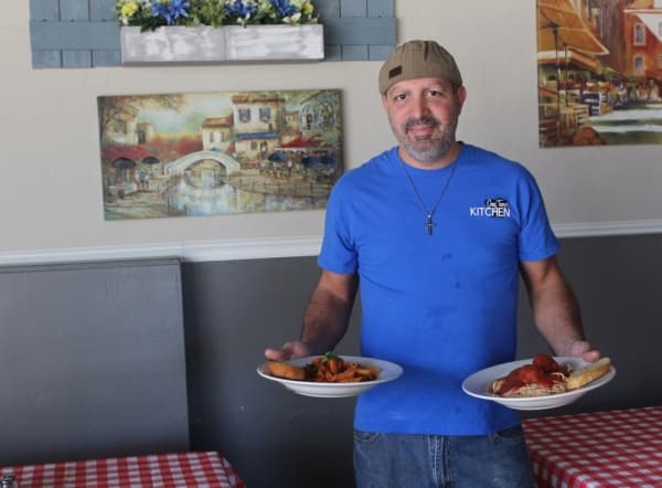 Ambrogio “Ambrose” Buraglia, the owner and chef at Guy Tano’s Kitchen, said he learned to cook authentic Italian food from his father. (Brian Perdue/Community Impact Newspaper)