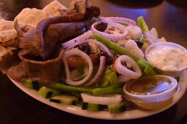 Greek Salad with Gyro Meat ($6.95 + $3.95 for the meat) 
The classic salad mixes lettuce, red onions, cucumbers, tomatoes, feta cheese, Kalamata olives and Aladdin’s original Greek dressing. For an added price, customers can also add chicken breast, gyro meat, falafel or calamari to the dish.
Amber Friend/Community Impact Newspaper