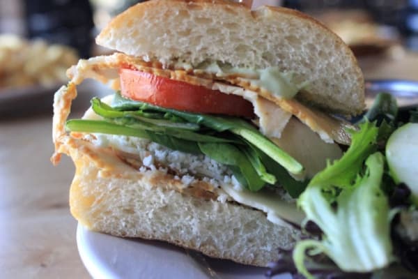 The Getty sandwich: $7.95. This chicken and pesto mayo sandwich includes marinated tomatoes and spinach and is topped with melted provolone and feta cheese. Jack Flagler/Community Impact Newspaper