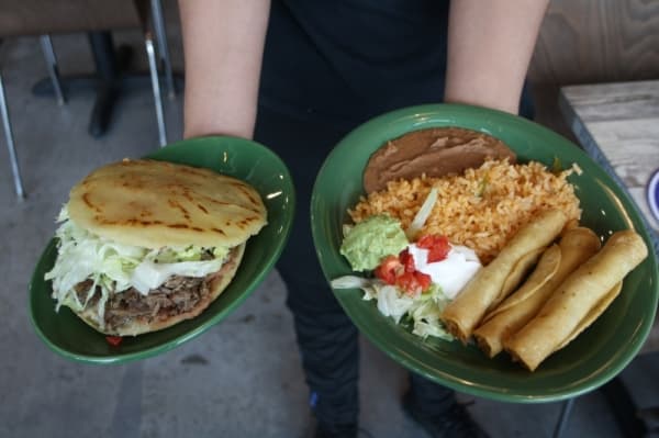 Chicken flautas plate ($9.50): Small tortillas are filled with chicken and rolled on a plate and served with a side of refried beans and rice, guacamole and sour cream. (Danica Smithwick/Community Impact Newspaper)