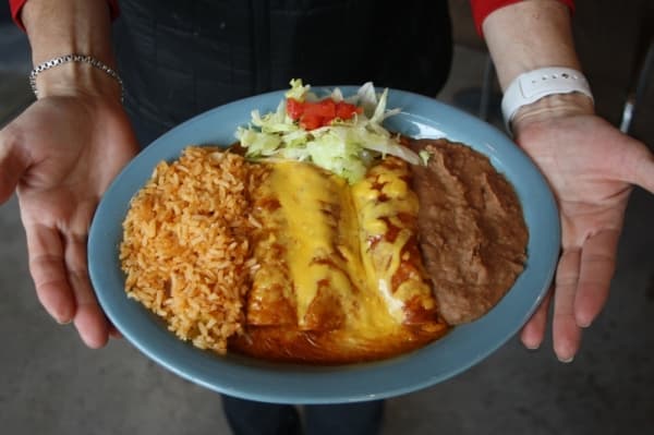 Enchiladas ($8.50-$10.50): Cheese, ground beef, shredded chicken or fajita meat enchiladas are served with refried beans and rice. (Danica Smithwick/Community Impact Newspaper)