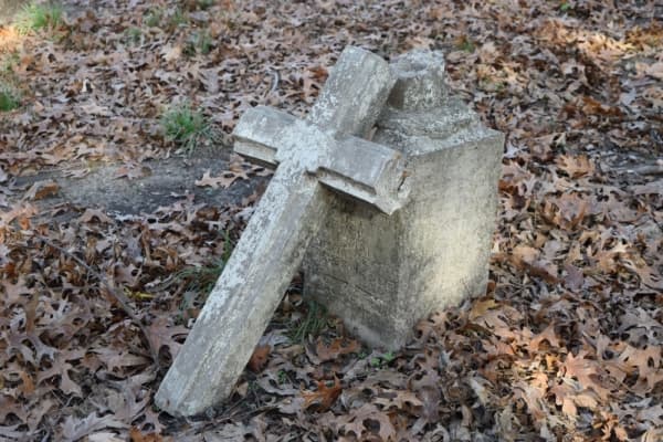 Several headstones have deteriorated and broken over the years. (Emily Davis/Community Impact Newspaper) 
