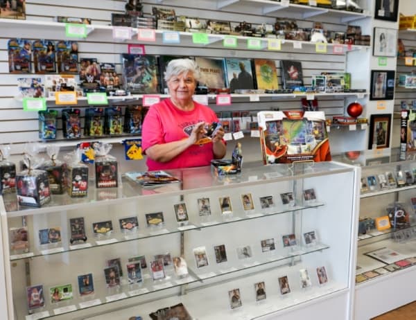 Humble native Anthony Macias turned his hobby of collecting sports trading cards into a career when he opened Triple Play Treasures. (Kathleen Sison/Community Impact Newspaper)
