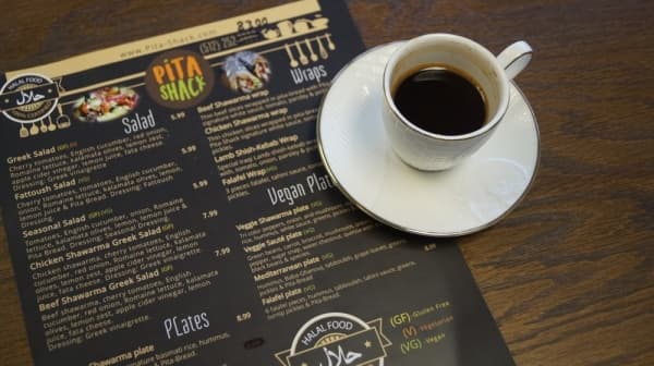 Pita Shack serves Turkish coffee, a style prepared by boiling ground coffee beans with sugar and cardamom. (Kelsey Thompson/Community Impact Newspaper)