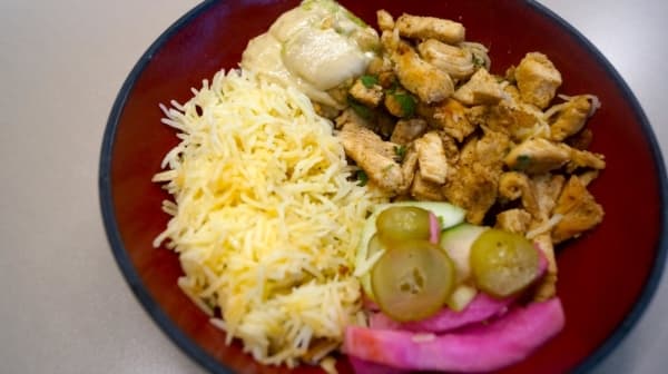 While owners Ayman Attar Bashi and Raya Thanoon said it is difficult to choose Pita Shack's most popular dish, each said their chicken shawarma plate is universally beloved. (Kelsey Thompson/Community Impact Newspaper)                                
