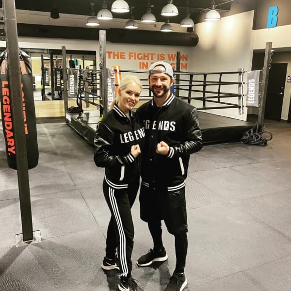 A photo of two Legends Boxing workers, flexing.